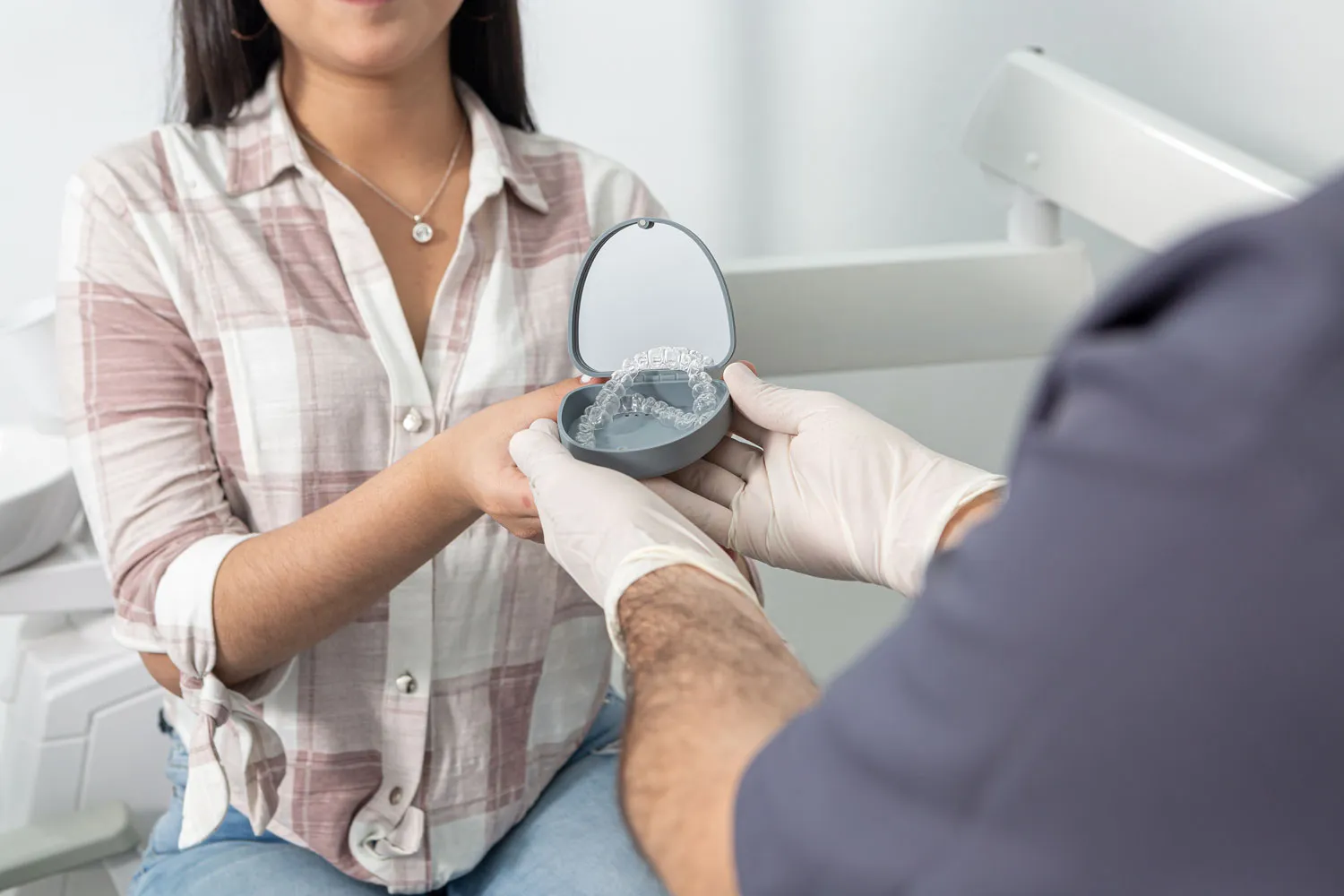 crop anonymous woman taking aligners box from dent 2023 11 27 05 12 53 utc
