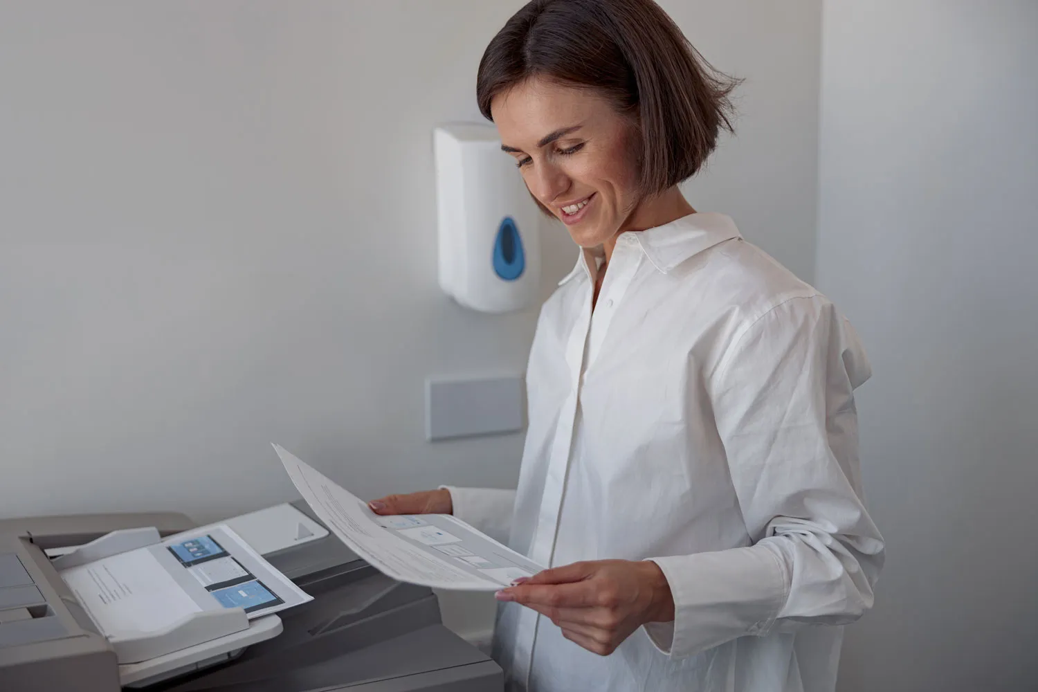 smiling woman worker scanning a document on photoc 2023 11 27 05 21 56 utc