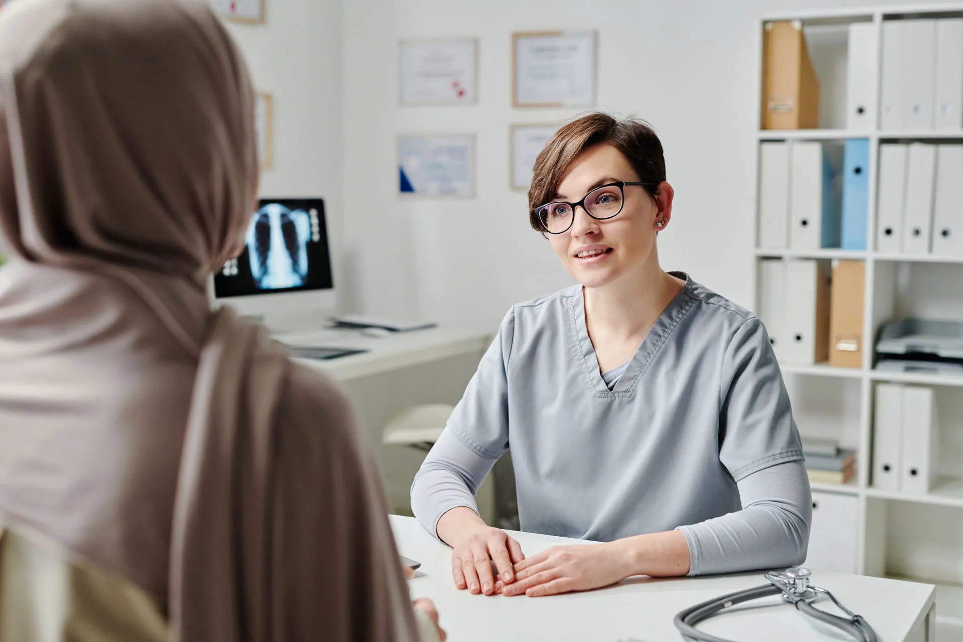young confident clinician in uniform consulting mu 2023 11 27 04 59 33 utc
